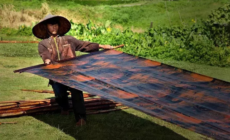 Craftsman holding fabric
