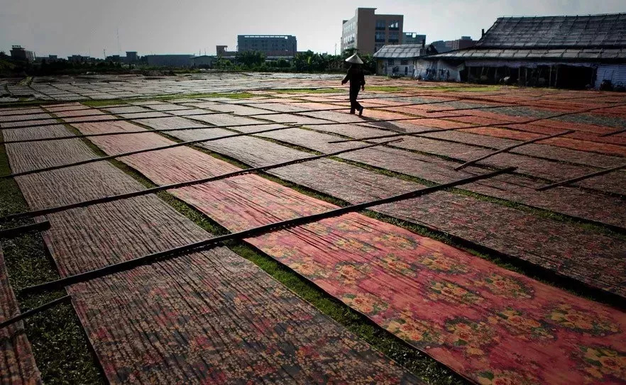 Fabric panels drying on grass